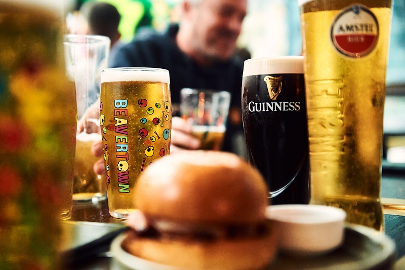 A burger, beavertown beer, guiness and two other pints