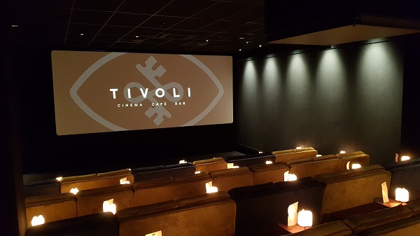 Interior of a cinema screen with the word Tivoli on the screen