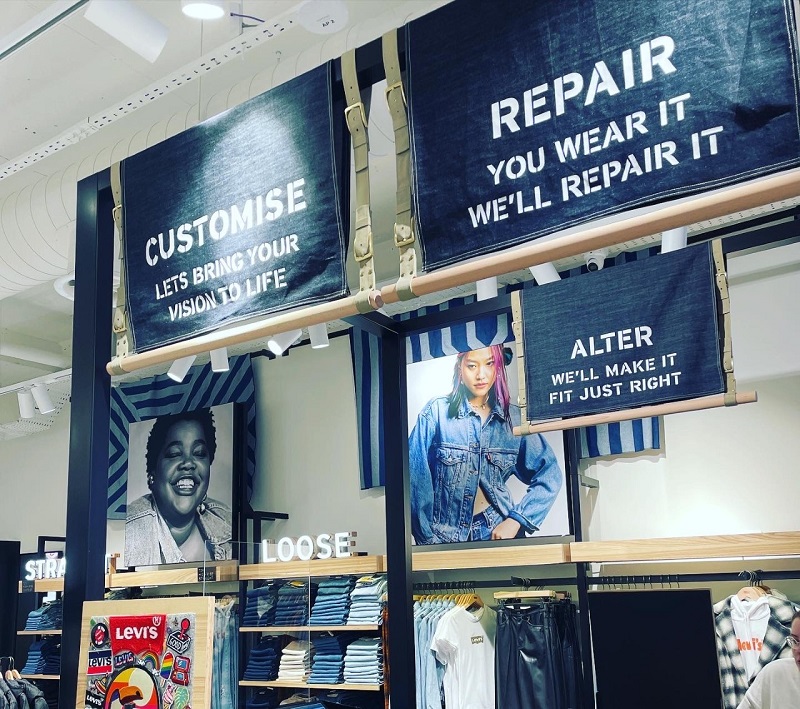 Some shop fittings in levis with 'customize' and 'alter' on signage